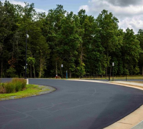 Sealcoating a road for Loudoun Country Public Schools