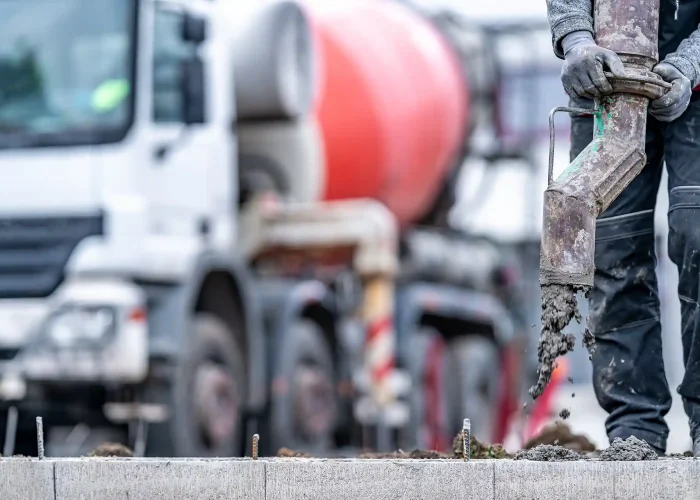 Workers lay new concrete.